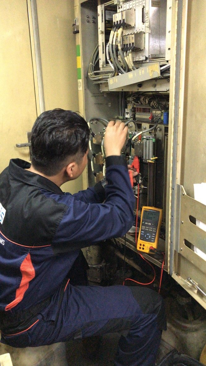 Technician carrying out electrical panel diagnostics